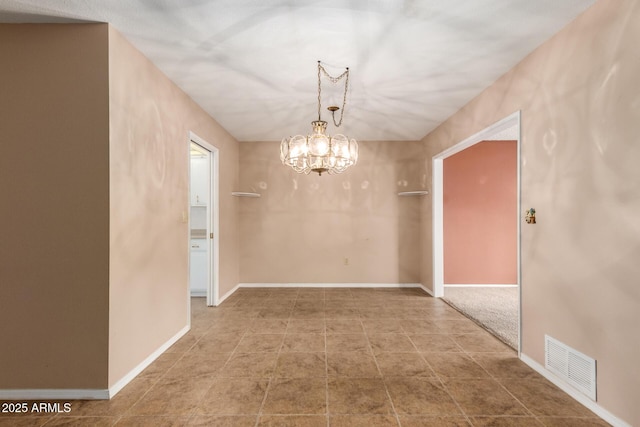 unfurnished dining area with a notable chandelier