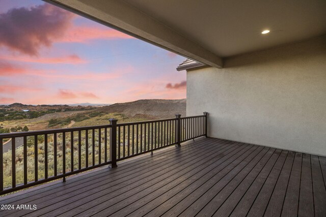 deck at dusk with a mountain view