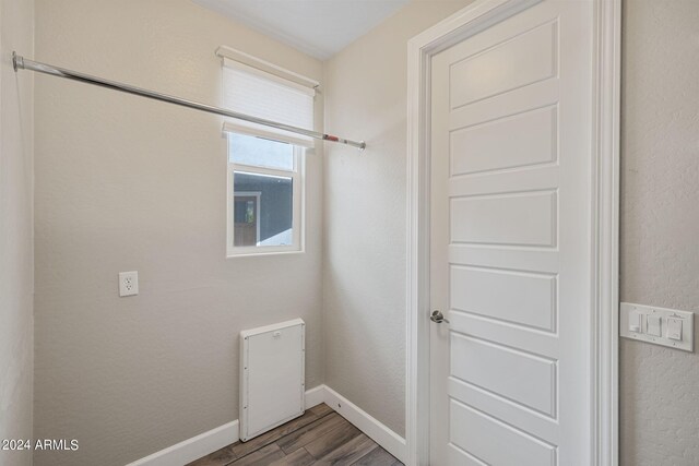 washroom with dark wood-type flooring