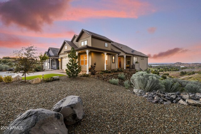 property exterior at dusk with a garage