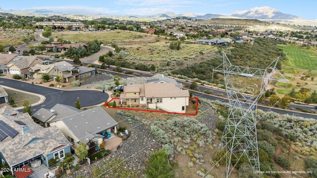 birds eye view of property with a mountain view