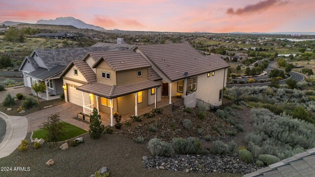 view of front of home with a mountain view and a porch