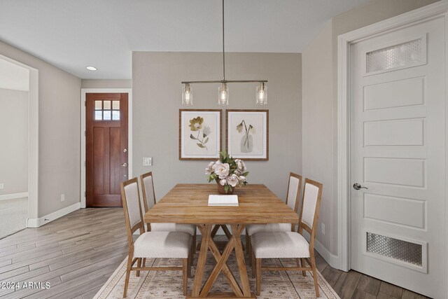 dining area with light hardwood / wood-style flooring