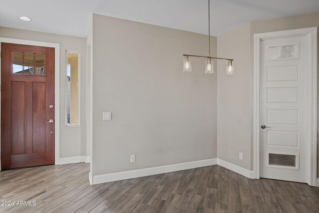 entryway with hardwood / wood-style floors