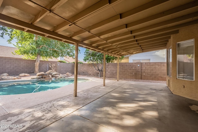 view of patio / terrace featuring a fenced in pool