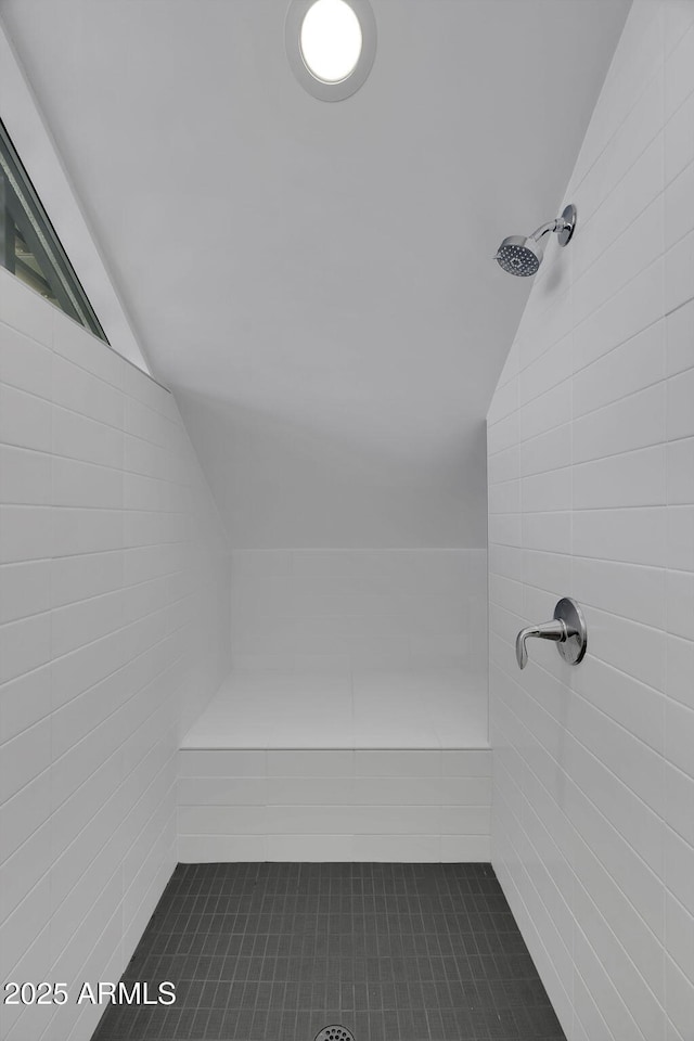 802 S 5th Ave, Tucson, AZ 85701 - full bathroom with vaulted ceiling, a tile shower, and tile patterned floors