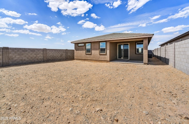 back of property featuring a patio