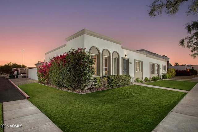 8317 E Orange Blossom Ln, Scottsdale, AZ 85250 - view of front of property with a lawn and stucco siding