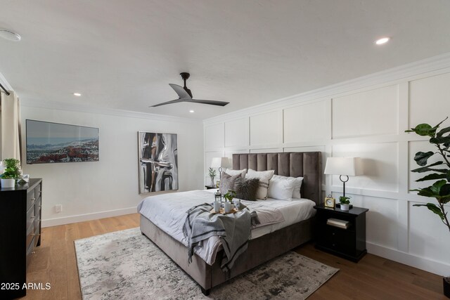 8317 E Orange Blossom Ln, Scottsdale, AZ 85250 - bedroom featuring wood finished floors, ornamental molding, recessed lighting, baseboards, and ceiling fan