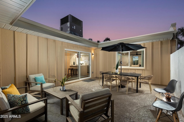 8317 E Orange Blossom Ln, Scottsdale, AZ 85250 - view of patio / terrace featuring an outdoor hangout area, outdoor dining space, and central AC