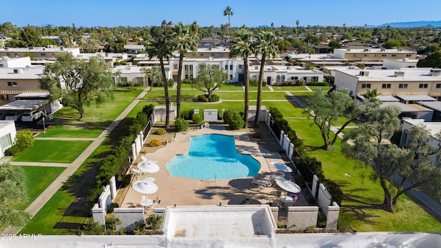 8317 E Orange Blossom Ln, Scottsdale, AZ 85250 - community pool featuring a residential view and area for grilling