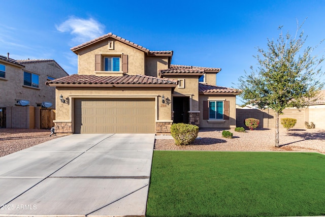 mediterranean / spanish house with driveway, fence, and stucco siding