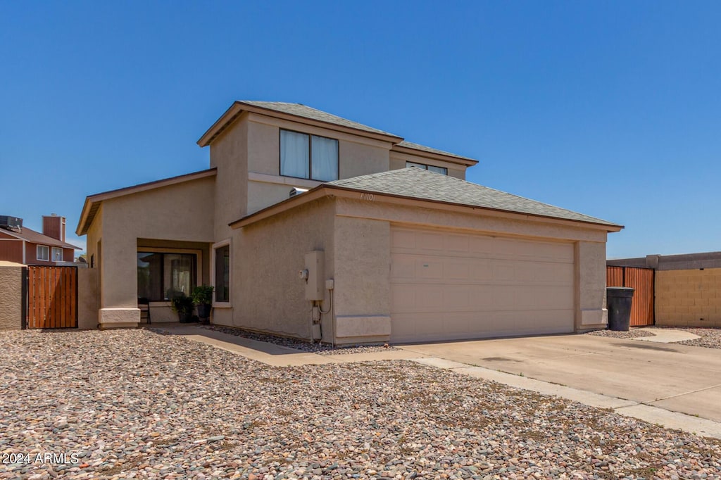 back of property with a garage