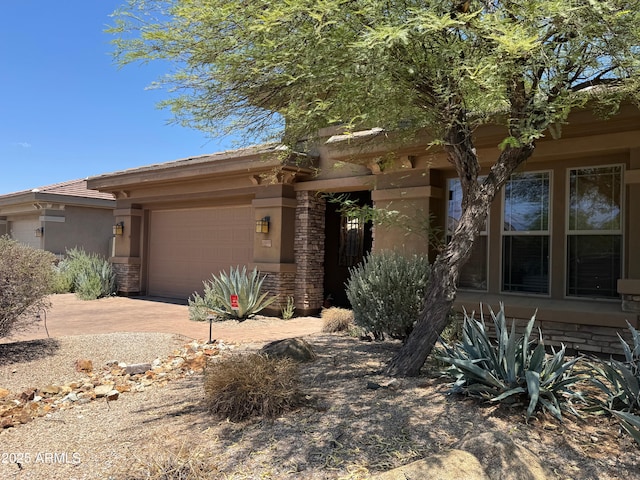 18008 W Ocotillo Ave, Goodyear, AZ 85338 - view of front facade with a garage, driveway, and stucco siding