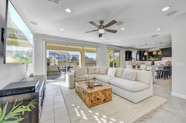 tiled living room featuring ceiling fan