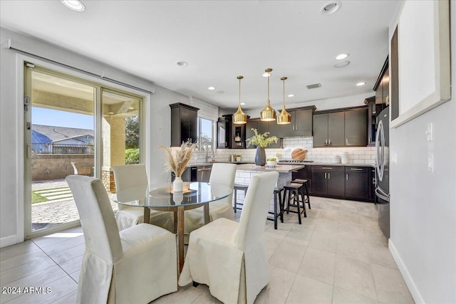 dining space with light tile patterned floors