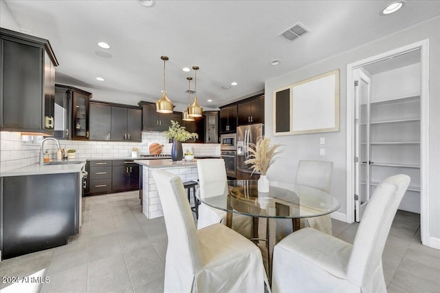 tiled dining space featuring sink