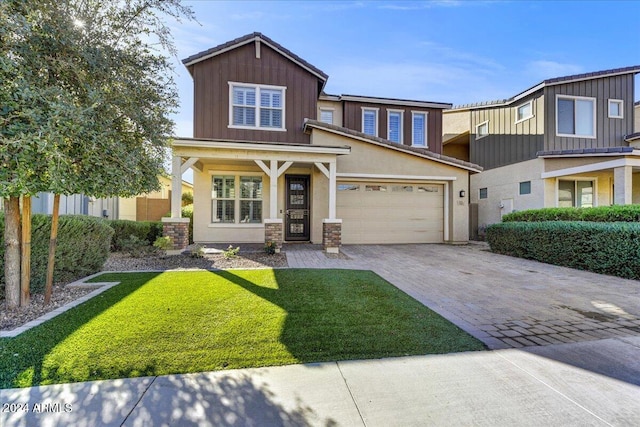 view of front of home featuring a garage and a front lawn