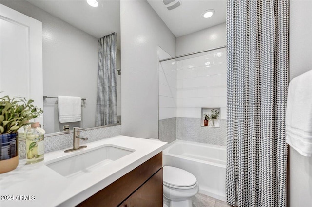 bathroom with tile patterned flooring, vanity, and toilet