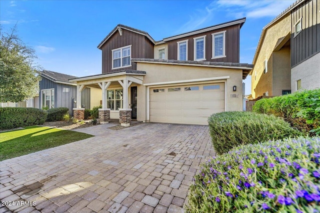 view of front of home featuring a garage and covered porch