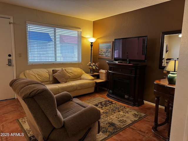 12123 W Bell Rd Unit 337, Surprise, AZ 85378 - living area featuring tile patterned flooring, a textured wall, and a fireplace