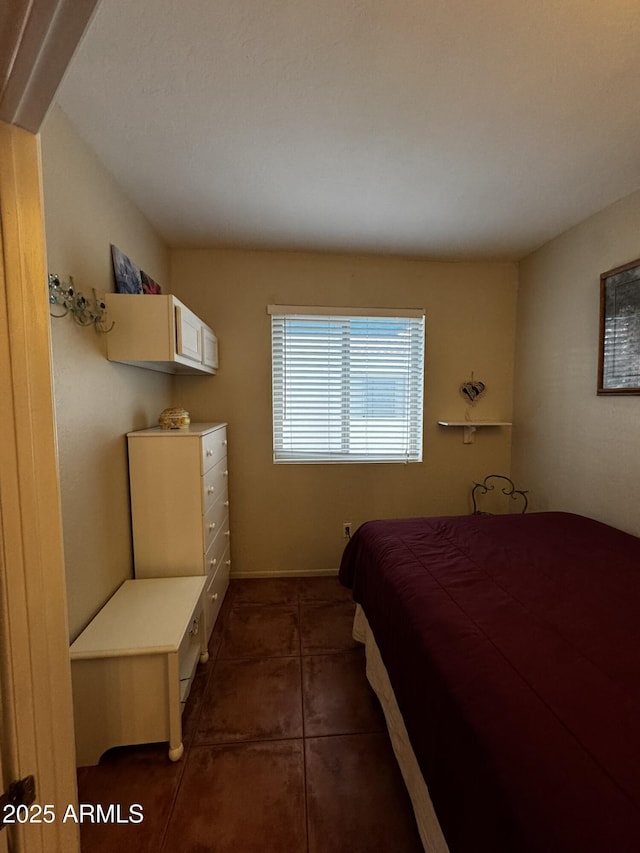 12123 W Bell Rd Unit 337, Surprise, AZ 85378 - bedroom with dark tile patterned floors