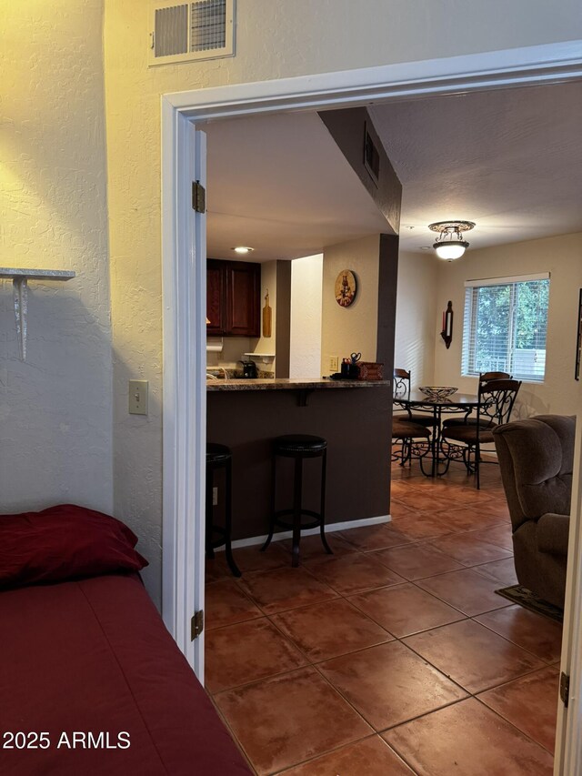 12123 W Bell Rd Unit 337, Surprise, AZ 85378 - interior space with tile patterned flooring and a textured wall