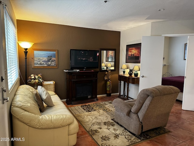 12123 W Bell Rd Unit 337, Surprise, AZ 85378 - tiled living room featuring a fireplace with raised hearth