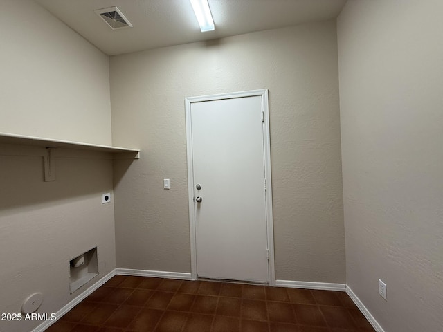 clothes washing area featuring laundry area, baseboards, visible vents, and hookup for an electric dryer