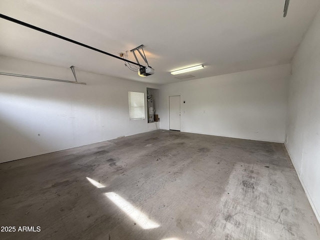 garage with a garage door opener and water heater