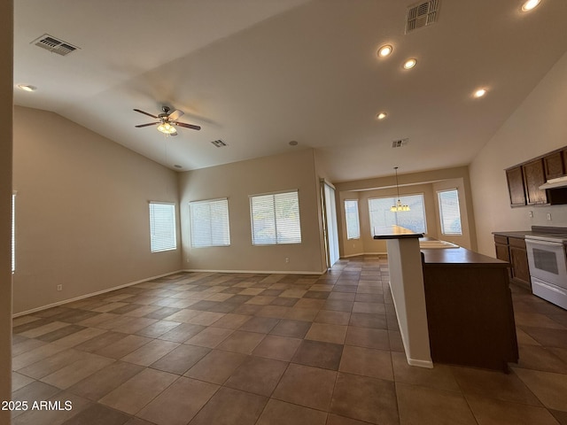 kitchen with white electric stove, open floor plan, visible vents, and a ceiling fan