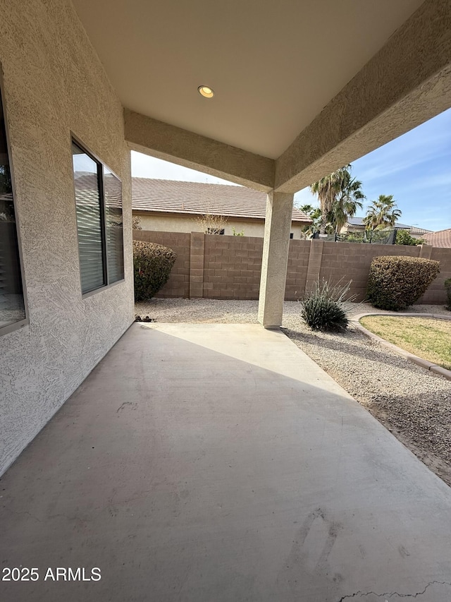 view of patio / terrace featuring fence