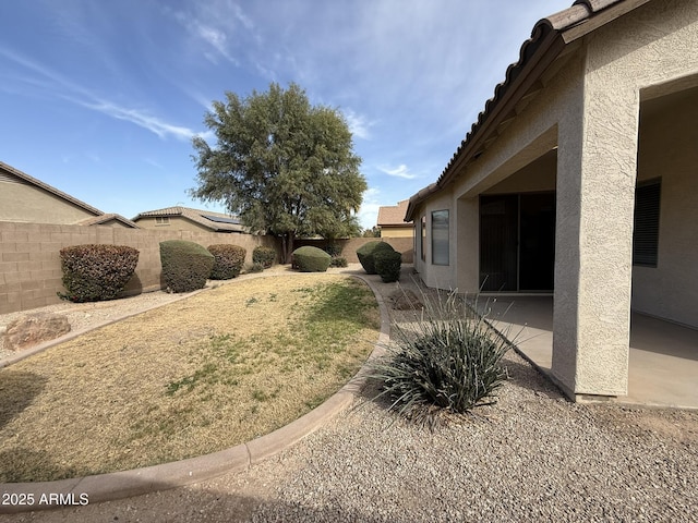 view of yard with a patio area and a fenced backyard