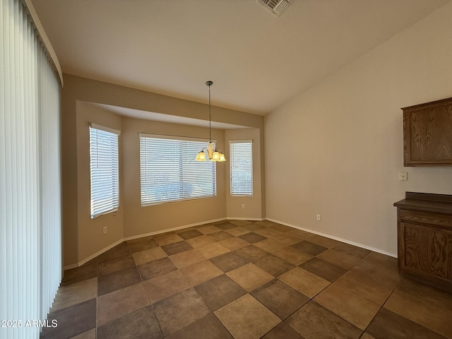 unfurnished dining area with lofted ceiling, visible vents, baseboards, and an inviting chandelier