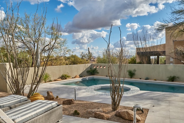 view of pool featuring an in ground hot tub and a patio