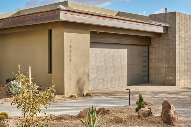 view of side of home with a garage