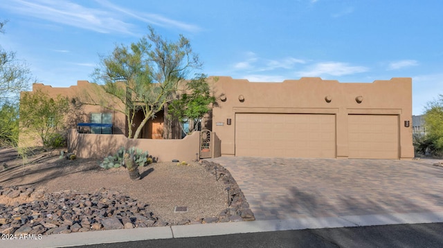 southwest-style home featuring a garage