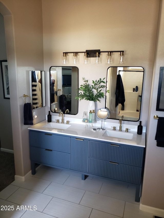 2004 N 108th Dr, Avondale, AZ 85392 - full bathroom featuring double vanity and baseboards