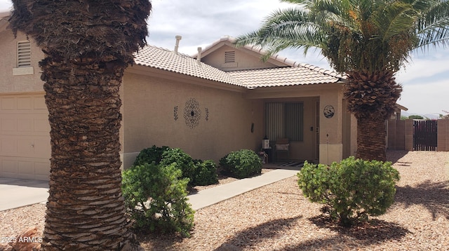 2004 N 108th Dr, Avondale, AZ 85392 - view of front of property featuring stucco siding, a tiled roof, and a garage