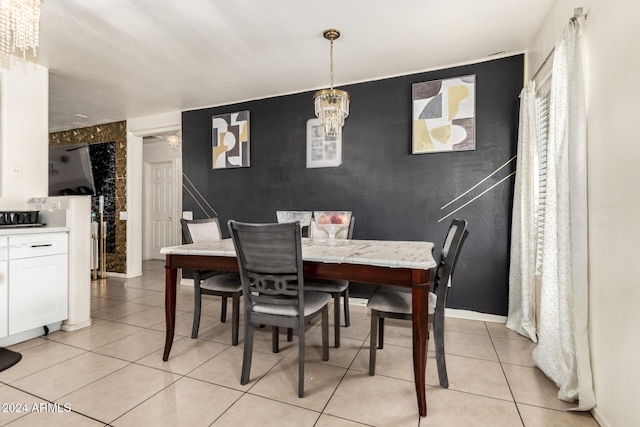 dining room with light tile patterned floors and a notable chandelier