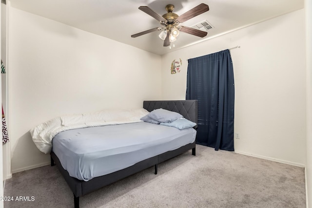 bedroom featuring light carpet and ceiling fan