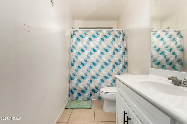 bathroom with tile patterned floors, vanity, and toilet