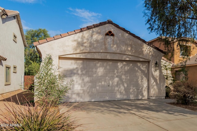 mediterranean / spanish-style home with a garage