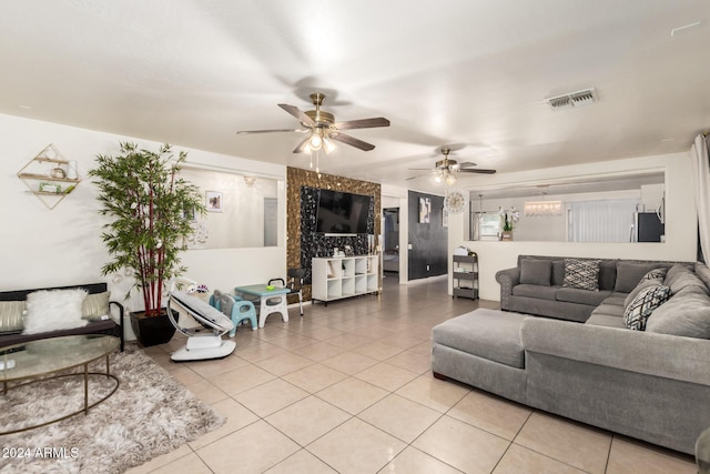 tiled living room with ceiling fan