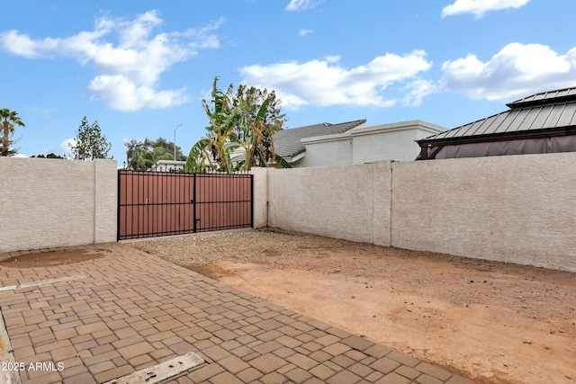 view of gate featuring fence