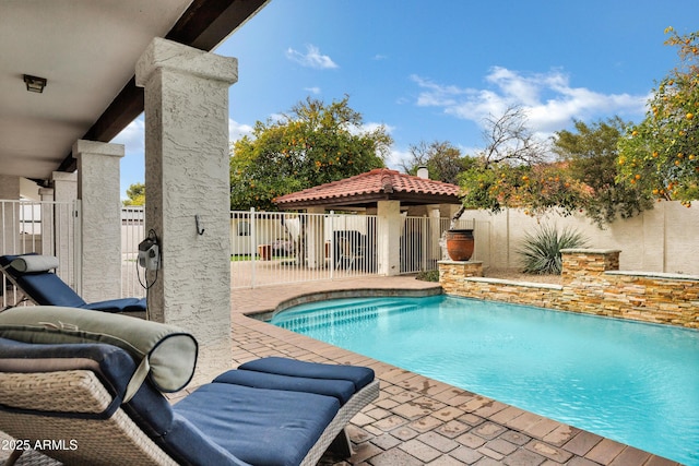 view of pool featuring a fenced in pool, a fenced backyard, and a patio area