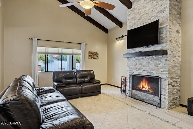 tiled living area featuring baseboards, beamed ceiling, a fireplace, high vaulted ceiling, and a ceiling fan