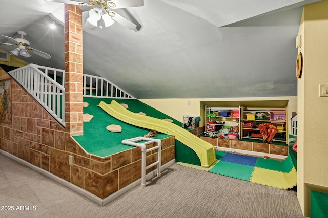 rec room featuring lofted ceiling, visible vents, carpet floors, and ceiling fan