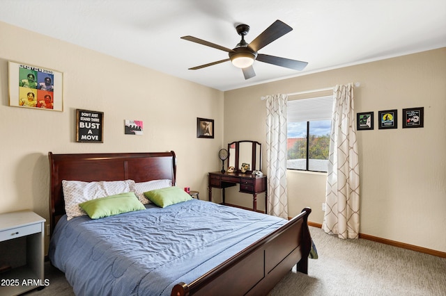 carpeted bedroom featuring a ceiling fan and baseboards