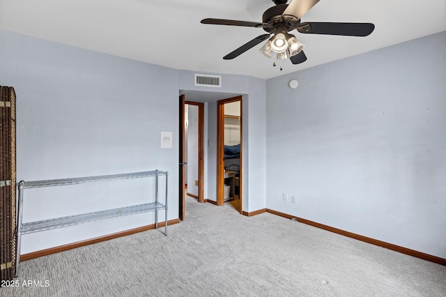 unfurnished bedroom featuring visible vents, a ceiling fan, baseboards, and carpet floors